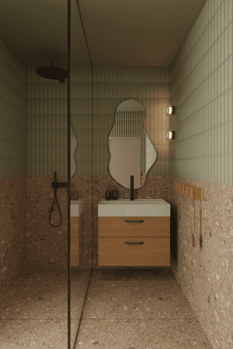 Koupelna apartmánu se zelenými kachličkami a moderními prvky.